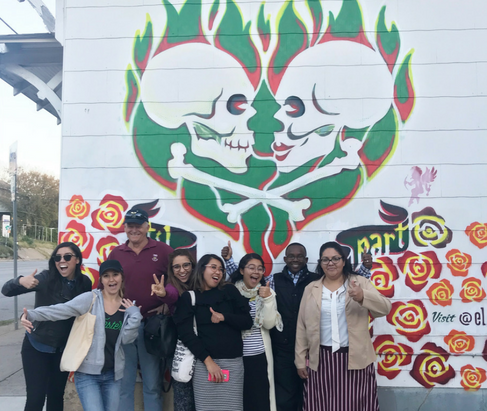 Group posing in front of "Until Death Do Us Part" mural in Austin, Texas