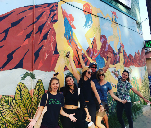 Group photo in front of street mural